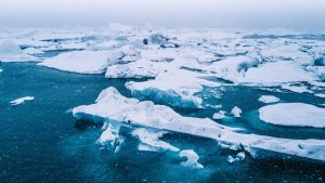 Densely packed sea ice on a vivid blue ocean