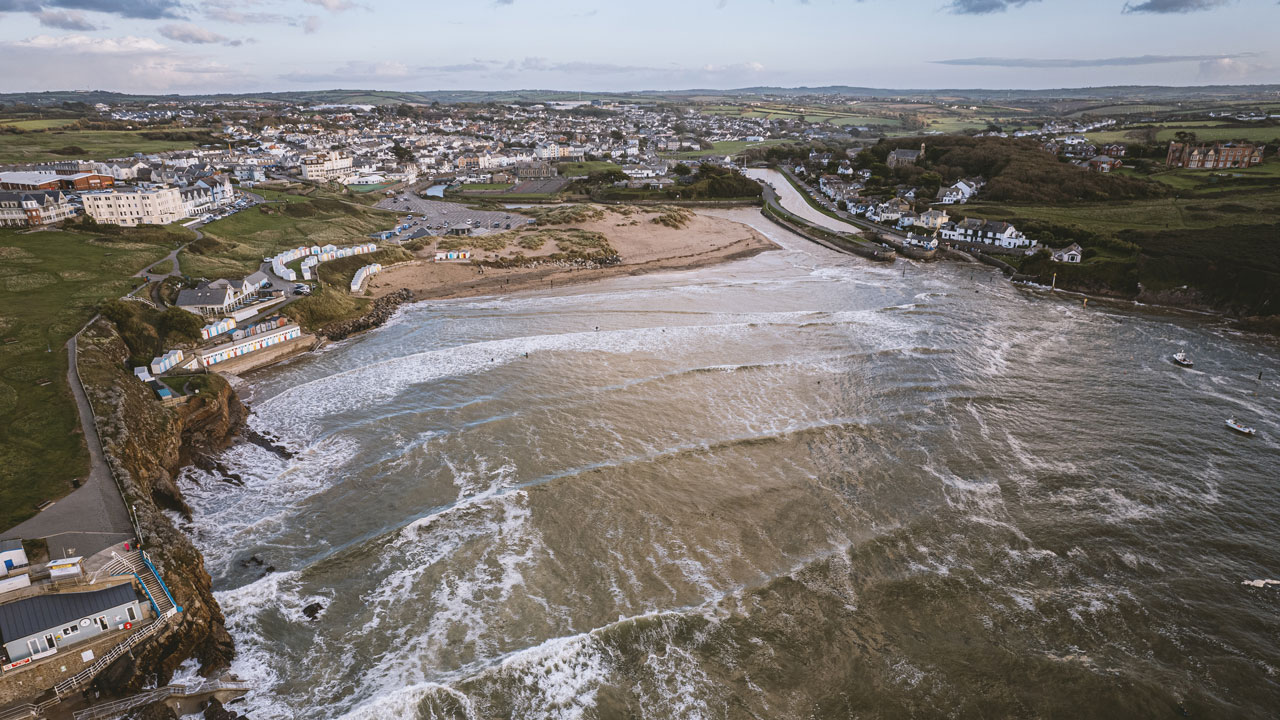 English coastline where waves meet small coastal houses