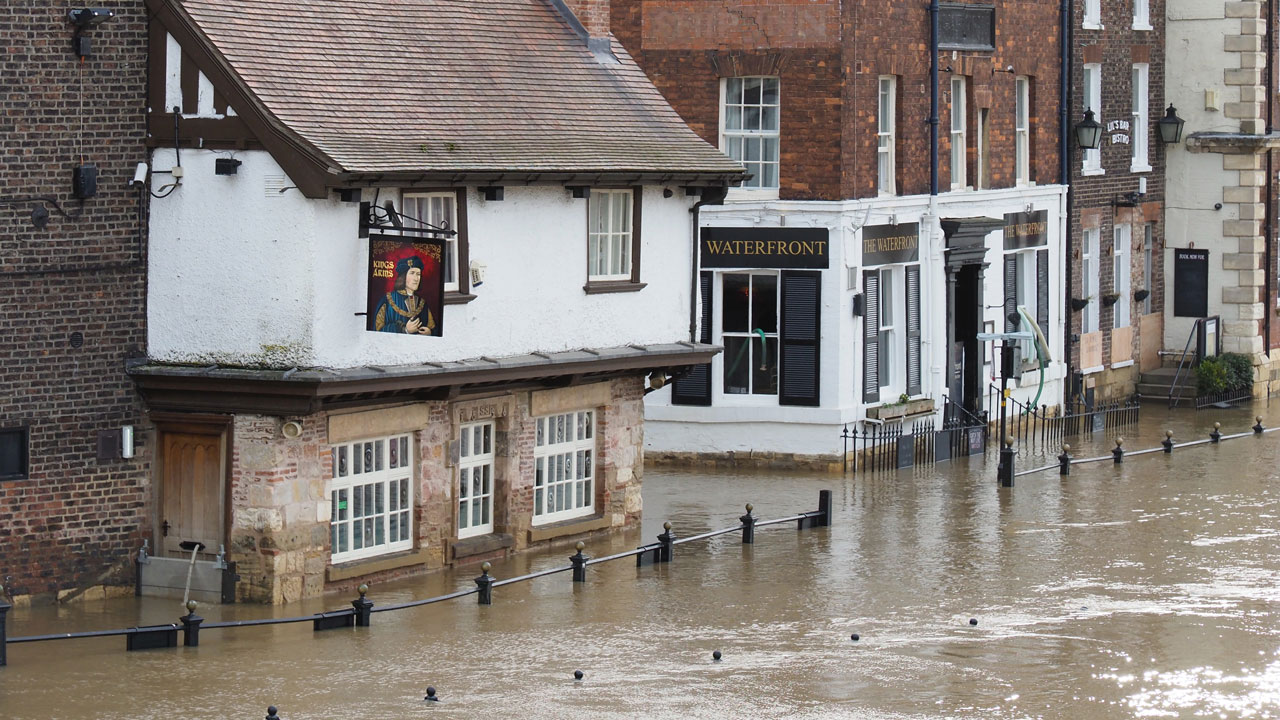 Quaint english buildings flooded by high water levels